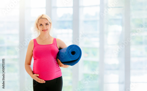 Pregnancy yoga. Exercise for pregnant woman.