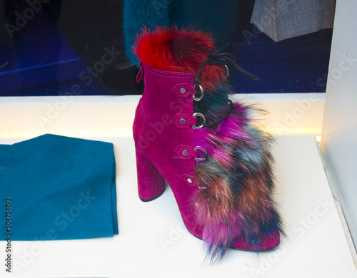Designer purple boot with a fur at store display in Milan photo