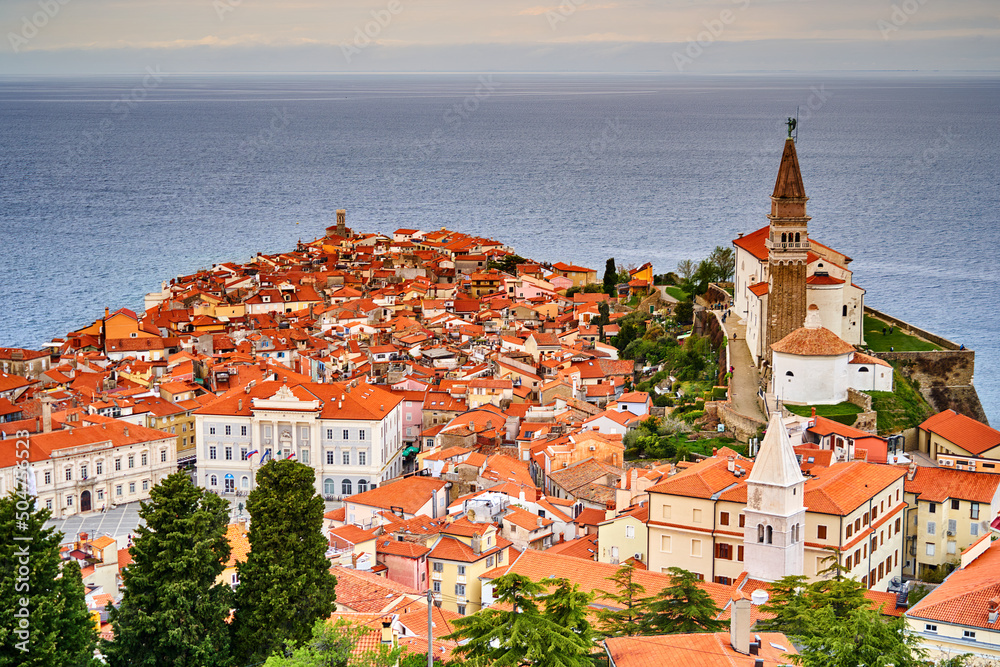 Aerial view with overview of narrow streets and roofs of the old town of Piran, Slovenia
