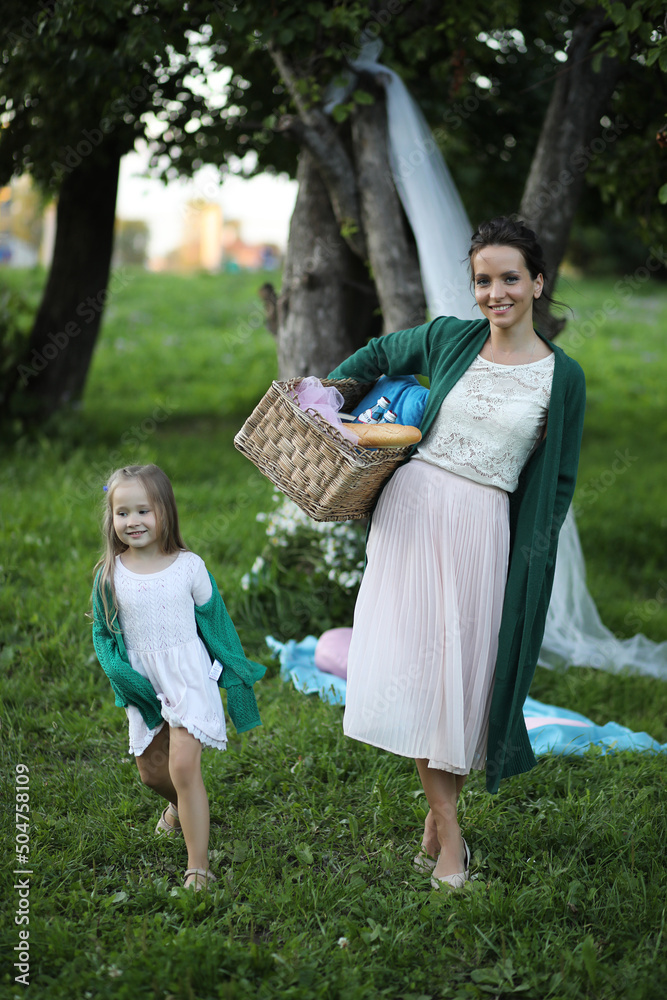 Fototapeta premium mother with daughter at a picnic