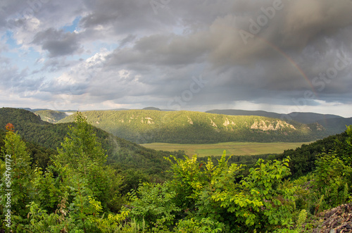 Southern Urals, Ural Mountains. A rainbow in a stormy sky.