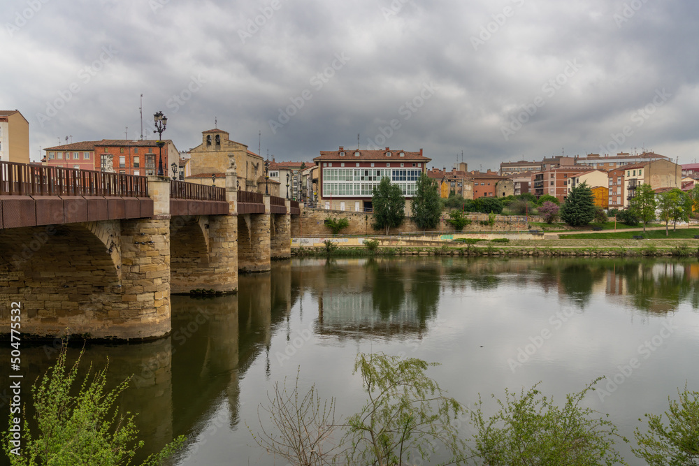 view of the stone bridge across the Ebro River and the historic city center of Miranda de Ebro