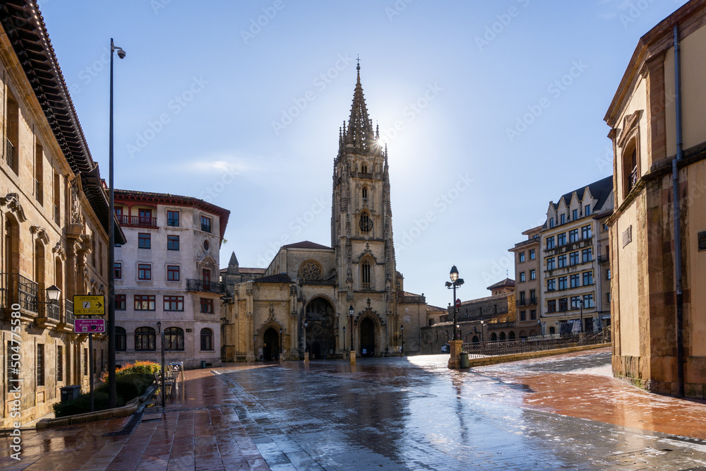 horizontal view of the San Salvador Cathedral and square in the historic city center of Oviedo with a sunburst