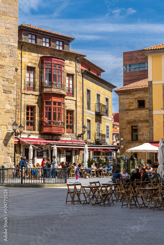 view of the lively and busy Plazuela de Marquez square with many people enjoying a sunny weekend day photo