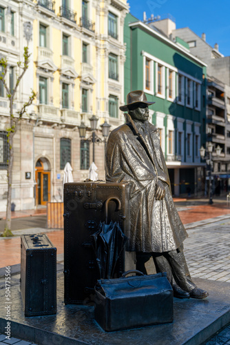 staute of man with suitcases in the historic city center of Oviedo