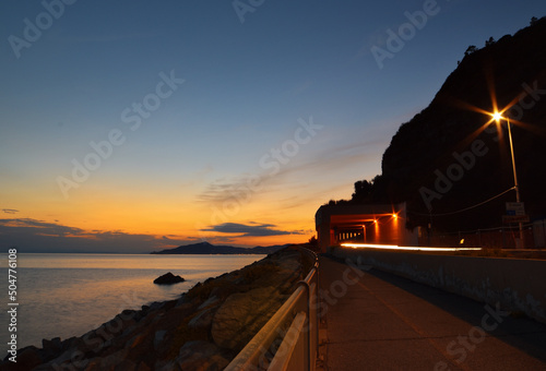 Beautiful sunset on a free beach in Liguria