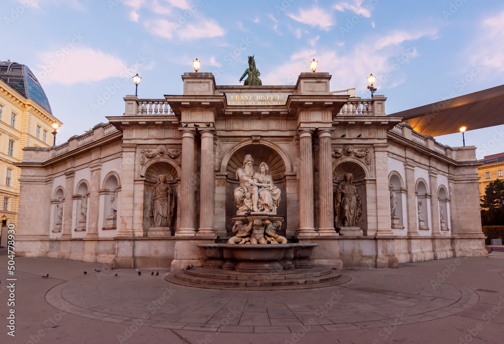 Obraz premium Neptune fountain on Albertinaplatz square at sunrise, Vienna, Austria