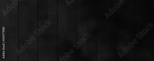 Black stone tile background. Dark banner with a tile texture pattern in the dark