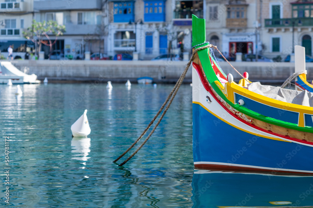 close-up of a traditional fisherman boat moring in a harbor on the island of Malta