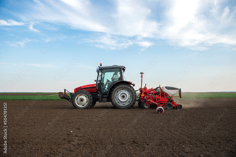 Sowing crops at agricultural fields in spring Sowing crops at agricultural fields in spring