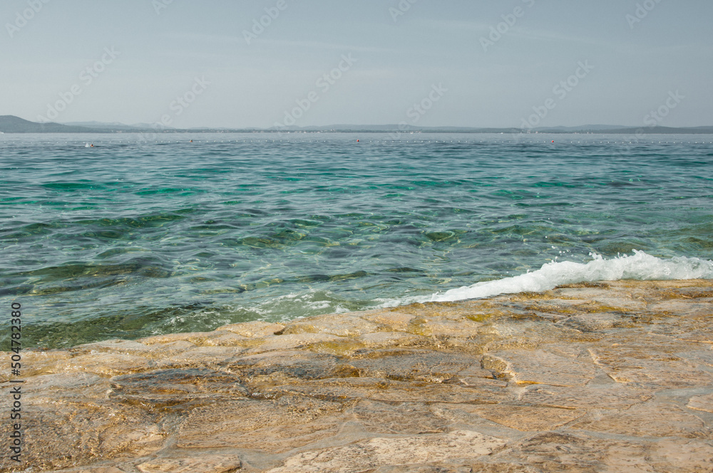 Adriatic Sea and part of the stone beach in Croatia.