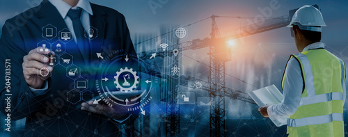 Fototapeta Naklejka Na Ścianę i Meble -  Future building construction engineering and technology project concept. double exposure graphic with engineer using digital tablet and smart industry and IOT software to control operation.