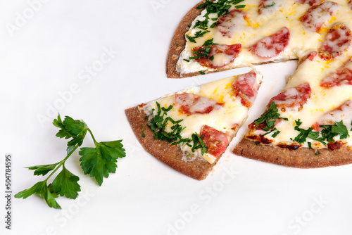 Pizza dietary with salami and cheese on a white background