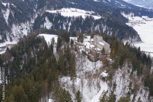 The snow covered castle of Itter, Austria in the winter. photo
