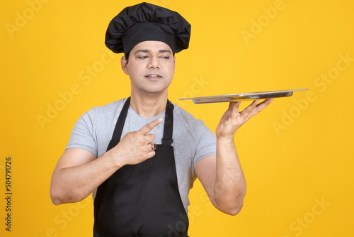 Chef guy with tray. Chef is...