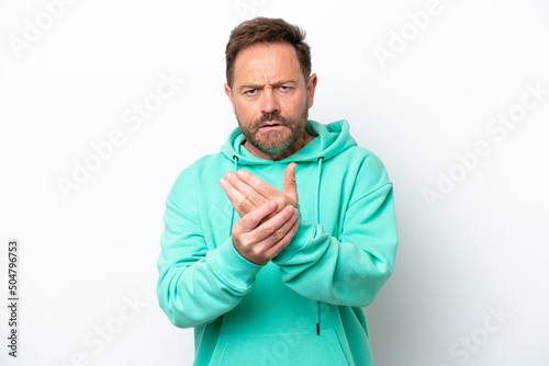 Middle age caucasian man isolated on white background suffering from pain in hands © luismolinero