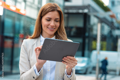 Portrait of a successful business woman using digital tablet