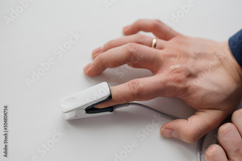 Pulse oximeter on a white background. Medical monitoring and diagnostic device for non-invasive measurement of capillary blood oxygen saturation