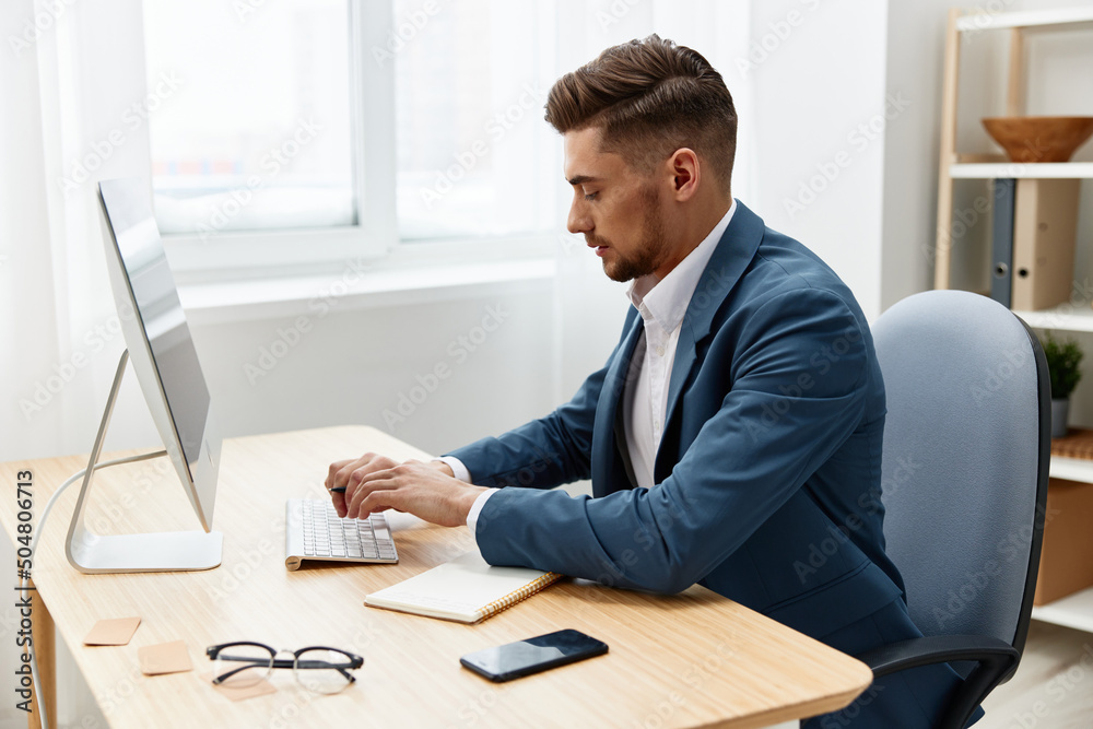 manager sitting at the computer work boss documentation Gray background manager sitting at the computer work boss documentation Gray background