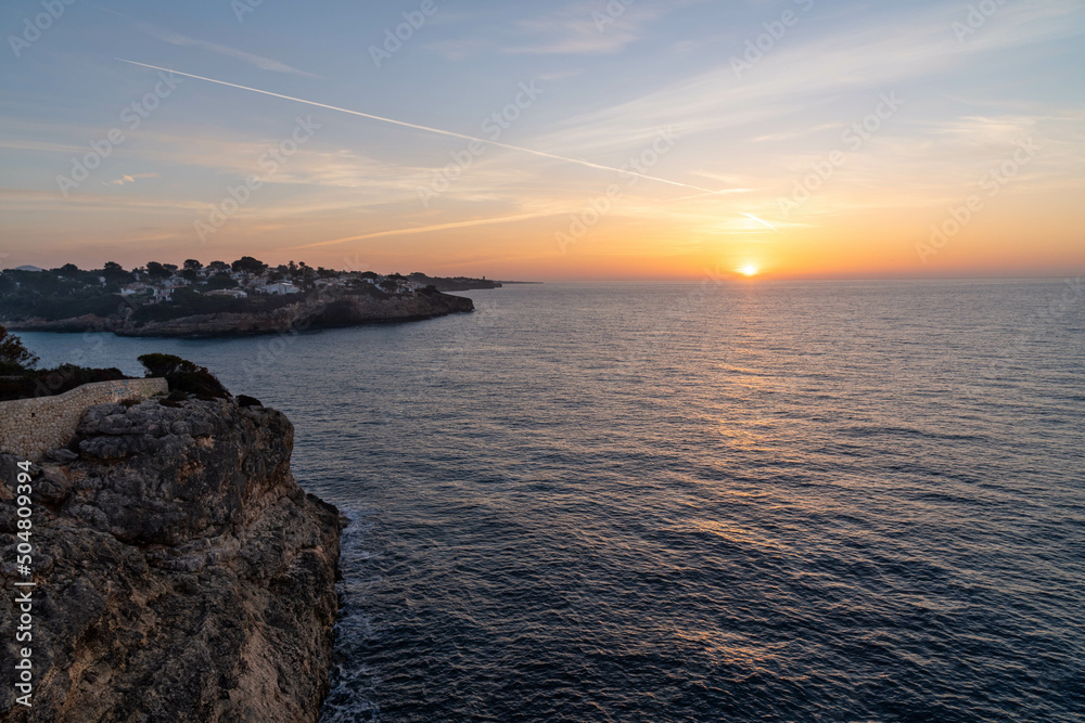 sunrise or sunset over the mediterranean sea, mallorca, spain