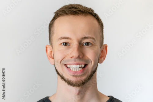 Handsome man with smile crooked teeth.