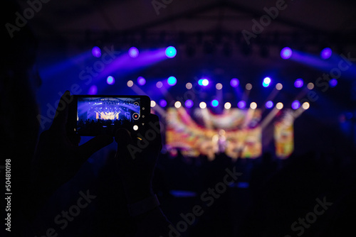 Hands with phones on concert, atmosphere on concert