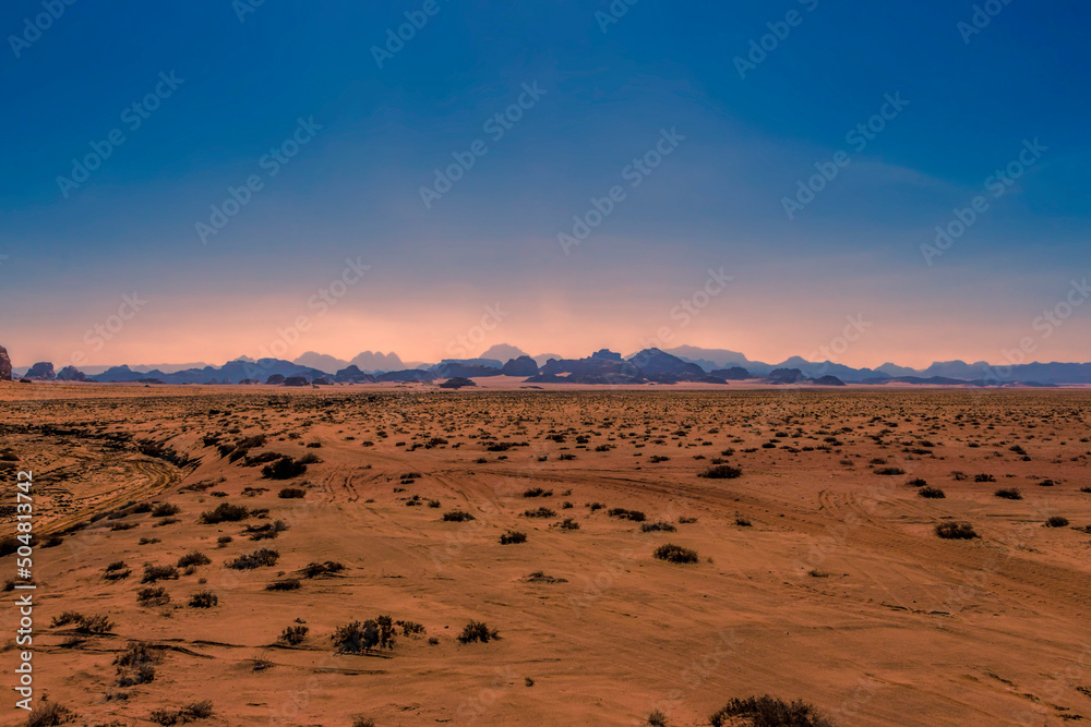 Vast stretches of desert at sunset in Wadi Rum, Jordan