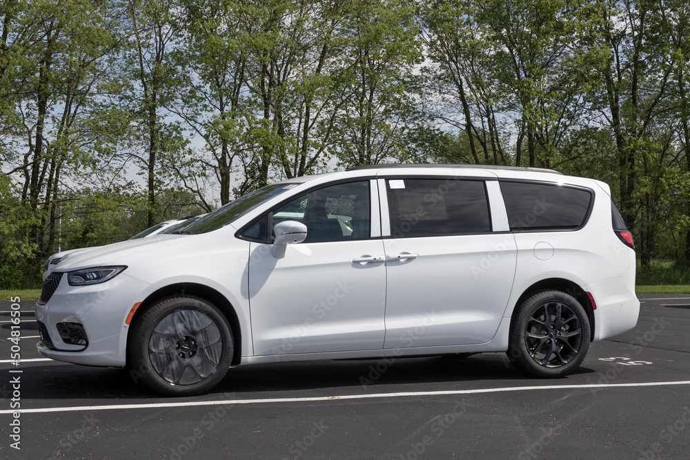 Chrysler Pacifica SUV minivan display at a dealership. Chrysler offers the  Pacifica in Touring, Limited, Hybrid and Pinnacle models. Stock Photo |  Adobe Stock
