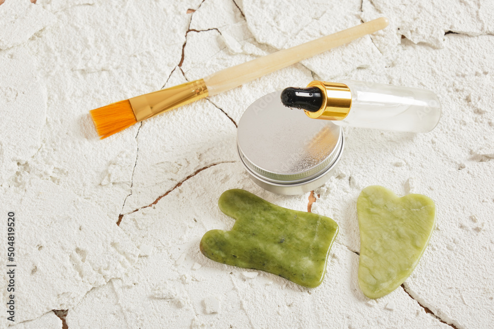 dry and tired skin care set on cracked white natural background dry and tired skin care set on cracked white natural background