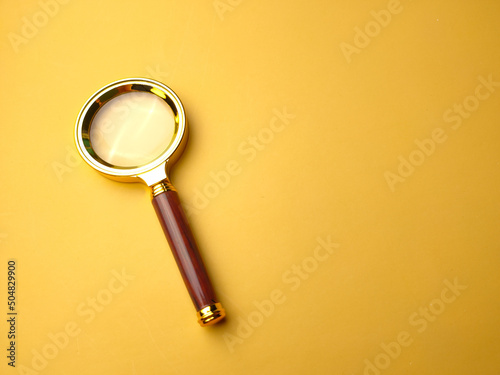 Vintage Brass Color Pocket Magnifying Glass/Magnifier Gift/60mm Portable on a yellow background.