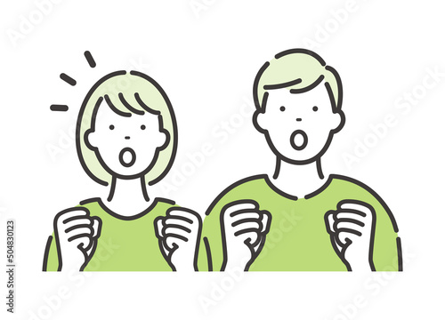 若い男女のカップル　両手を握りしめて驚くポーズ