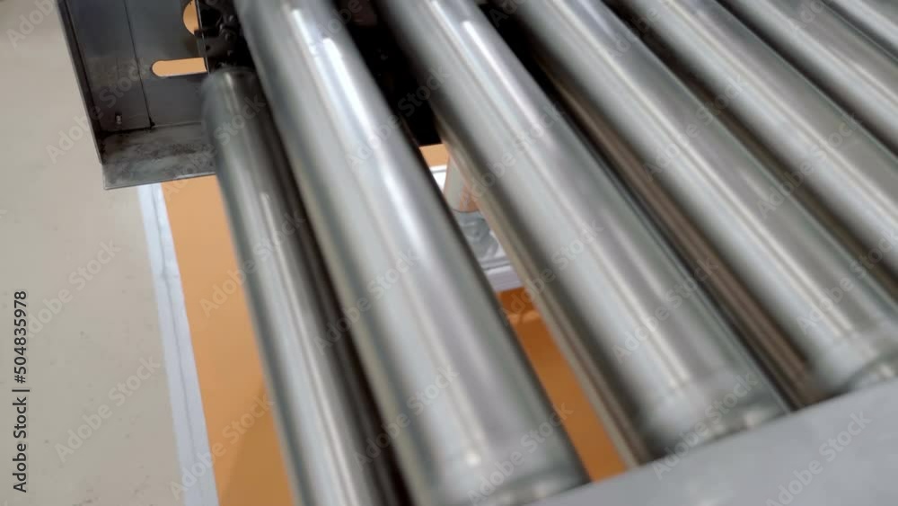 Roller conveyors are designed to transport solid or non-bulk goods of various sizes on industrial production. Closeup Roller conveyors are designed to transport solid or non-bulk goods of various sizes on industrial production. Closeup