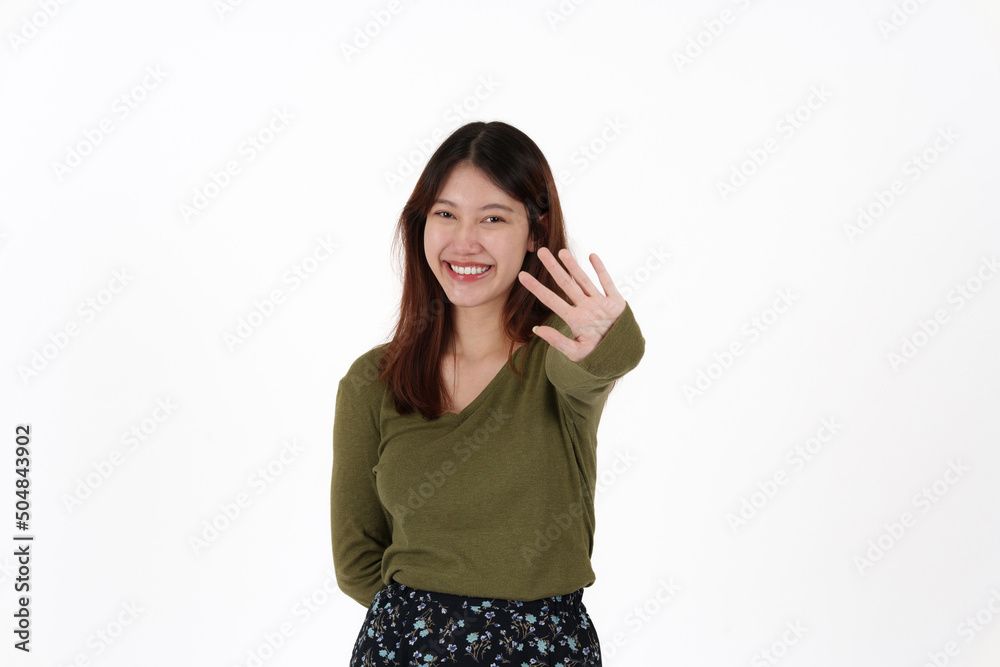 Image of happy young girl standing and Looking camera pointing isolated over white background. Image of happy young girl standing and Looking camera pointing isolated over white background.