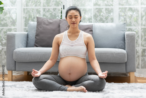 Tablou canvas Happy Calm Pregnant Woman deep breath with fresh air do yoga lotus pose comforta