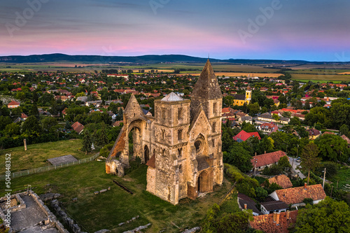 Zsambek  Hungary - Aerial view of the beautiful Premontre Monastery ruin church of Zsambek  Schambeck  with cemetery and ccolorful sky at background at summertime