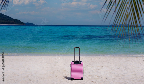 The Banner of travel  holiday vacation in Summer tropical concept with Pink luggage on the white sand Beach background © SASITHORN