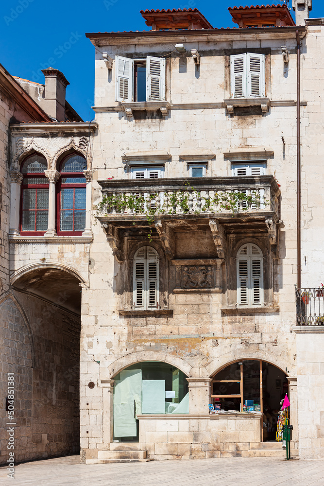 Old streets, architecture. Old facades and red tiled roofs. Vacation in the south of Europe. Exterior of buildings. Old style.