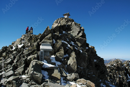 the summit of Mt. hotaka / 初冠雪した奥穂高岳の山頂サミット photo