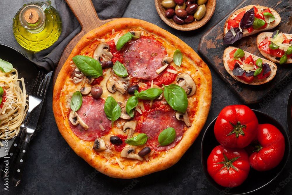 Italian cuisine. Pizza, pasta and toasts Italian cuisine. Pizza, pasta and toasts
