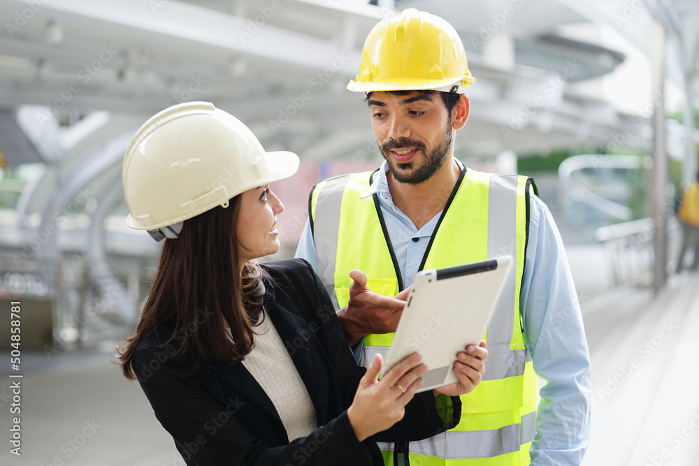 A man engineer discussing to coworker about project engineering on construction site A man engineer discussing to coworker about project engineering on construction site