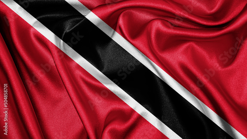 Close up realistic texture fabric textile silk satin flag of Trinidad and Tobago waving fluttering background. National symbol of the country. 31st of August, Happy Day concept
