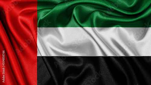 Close up realistic texture fabric textile silk satin flag of United Arab Emirates waving fluttering background. National symbol of the country. 2nd of December, Happy Day concept
 photo