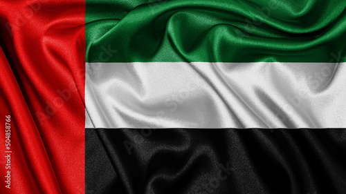 фотографія Close up realistic texture fabric textile silk satin flag of United Arab Emirates waving fluttering background