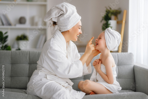 Принти на полотні Mother and daughter after a bath