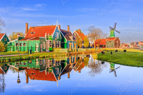 Zaanse Schans village, Netherlands. Dutch windmill and traditional house at sunrise. photo