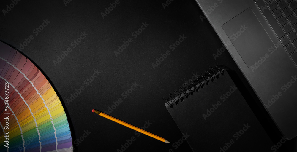 designer workspace with laptop, notepad and color swatch on black background. banner with copy space - obrazy, fototapety, plakaty 