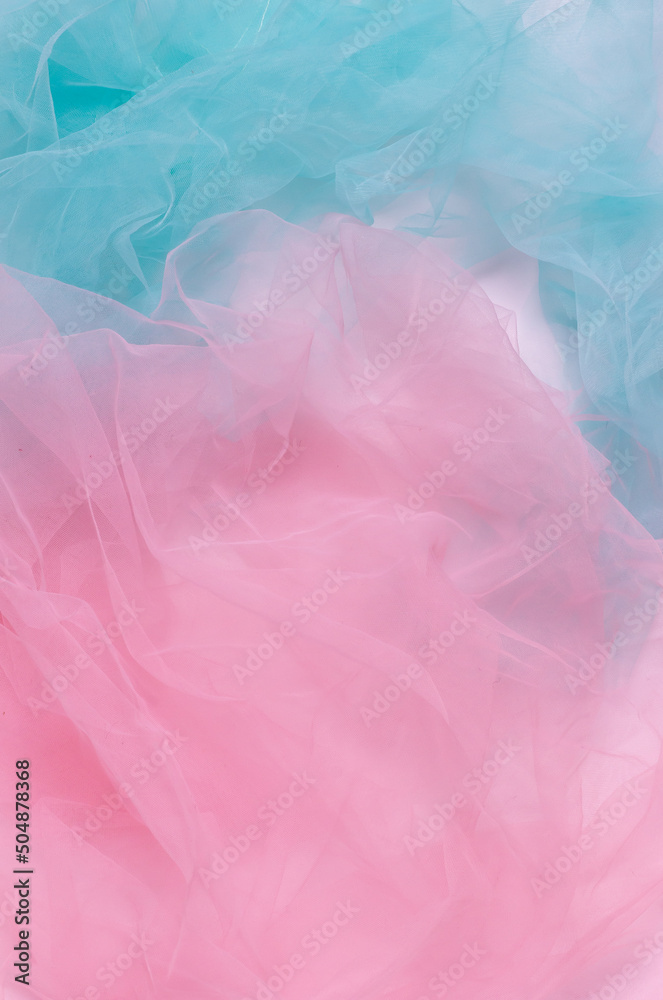 Abstract colorful background, pink and blue light wrinkled fabric