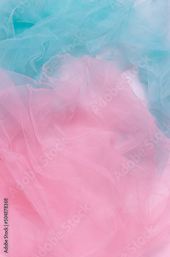 Abstract colorful background  pink and blue light wrinkled fabric