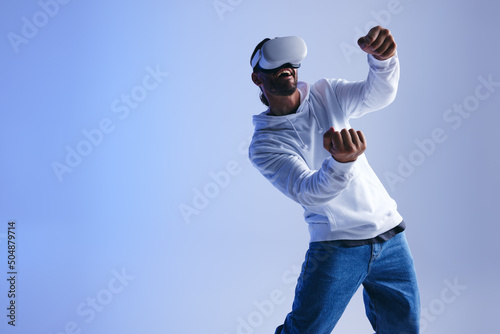 Cheerful young man driving in a 3D video game photo