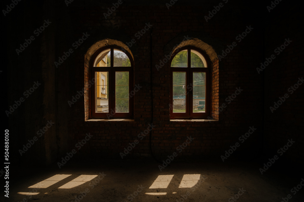 sunny day through the window. dark space lighted by the sun. High quality photo